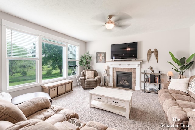 12150 Apple Cart Ln, Lowell, MI 49331 - living area with carpet flooring, ceiling fan, a tile fireplace, and baseboards