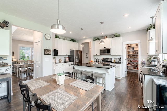 12150 Apple Cart Ln, Lowell, MI 49331 - dining space with dark wood-style floors and recessed lighting