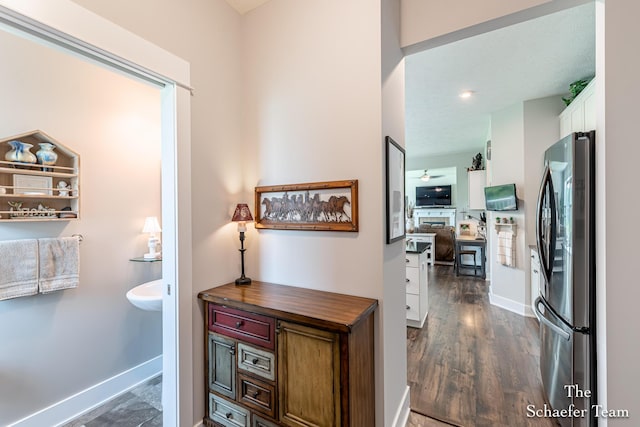 12150 Apple Cart Ln, Lowell, MI 49331 - hall featuring baseboards and dark wood-style flooring
