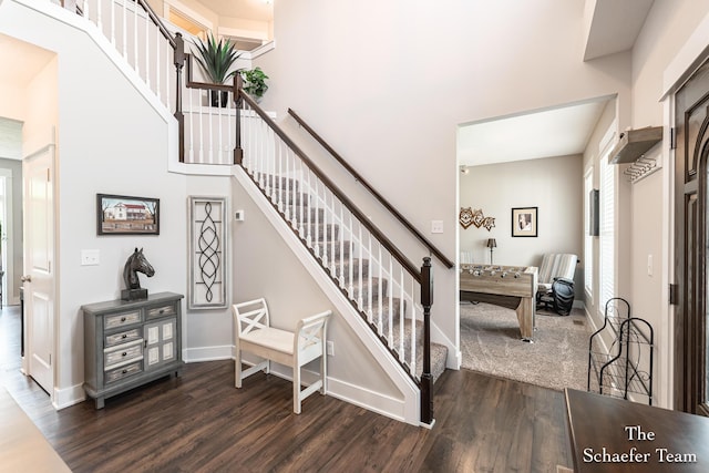 12150 Apple Cart Ln, Lowell, MI 49331 - stairway with wood finished floors, a towering ceiling, and baseboards