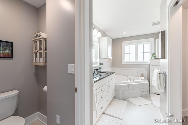 12150 Apple Cart Ln, Lowell, MI 49331 - bathroom featuring a bath, vanity, and toilet