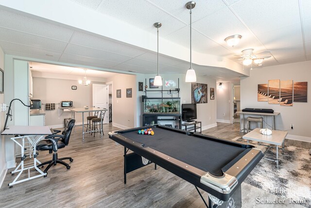 12150 Apple Cart Ln, Lowell, MI 49331 - rec room featuring baseboards, pool table, wood finished floors, a ceiling fan, and a drop ceiling