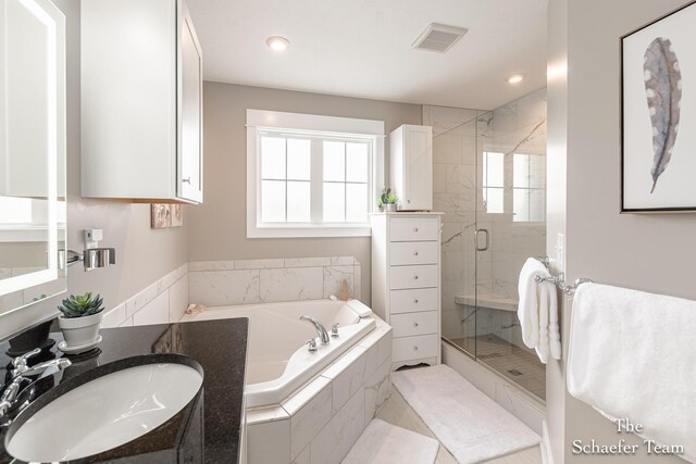 12150 Apple Cart Ln, Lowell, MI 49331 - full bathroom featuring a bath, a stall shower, recessed lighting, and vanity