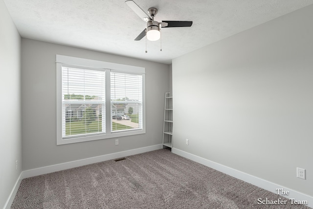 12150 Apple Cart Ln, Lowell, MI 49331 - carpeted empty room featuring baseboards, a textured ceiling, and a ceiling fan