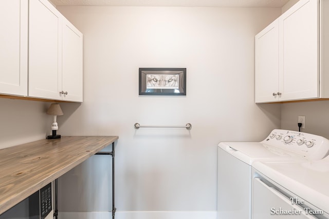 12150 Apple Cart Ln, Lowell, MI 49331 - laundry area featuring cabinet space and washer and dryer