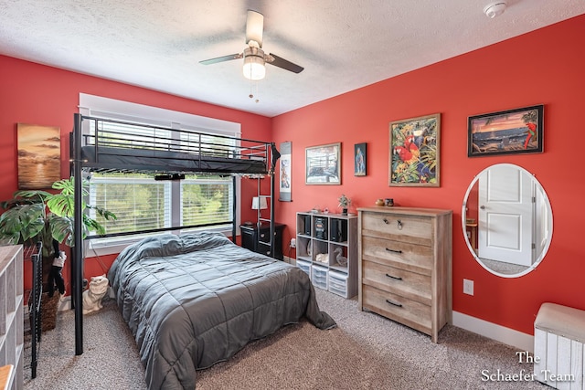 12150 Apple Cart Ln, Lowell, MI 49331 - carpeted bedroom with a textured ceiling, ceiling fan, baseboards, and radiator