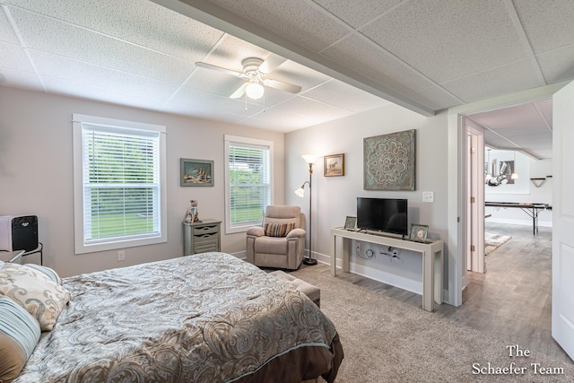 12150 Apple Cart Ln, Lowell, MI 49331 - bedroom featuring a drop ceiling, wood finished floors, ceiling fan, and baseboards