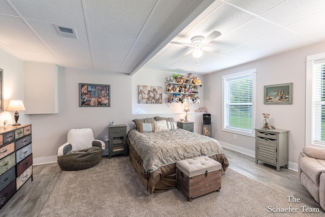 12150 Apple Cart Ln, Lowell, MI 49331 - bedroom with wood finished floors, baseboards, a drop ceiling, and a ceiling fan
