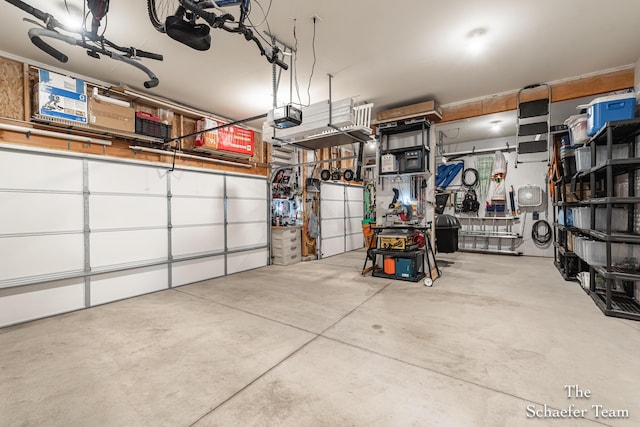 12150 Apple Cart Ln, Lowell, MI 49331 - garage featuring a garage door opener