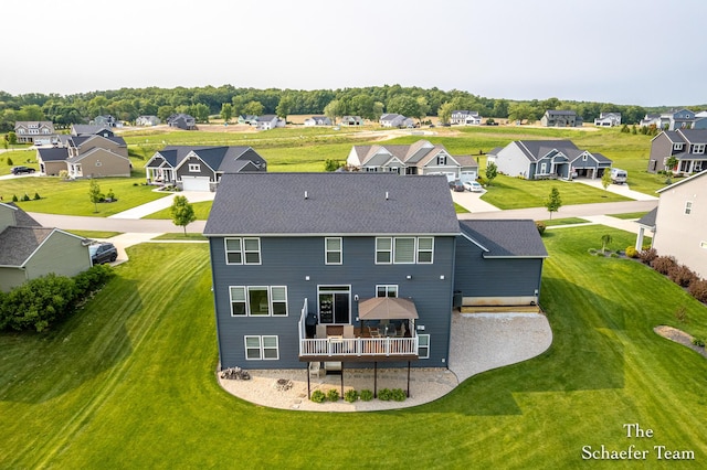 12150 Apple Cart Ln, Lowell, MI 49331 - back of property with a residential view, a deck, and a shingled roof