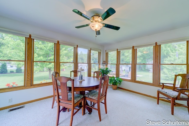 19151 Pine Grove Ct, Spring Lake, MI 49456 - dining space featuring baseboards, light carpet, and a ceiling fan