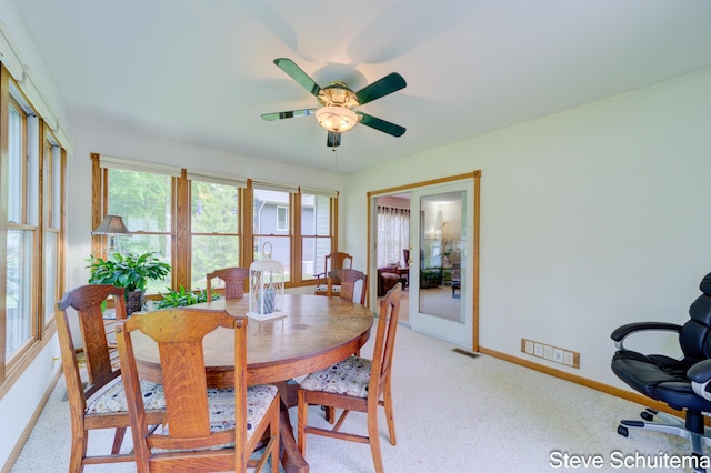 19151 Pine Grove Ct, Spring Lake, MI 49456 - dining room with baseboards, light colored carpet, and ceiling fan