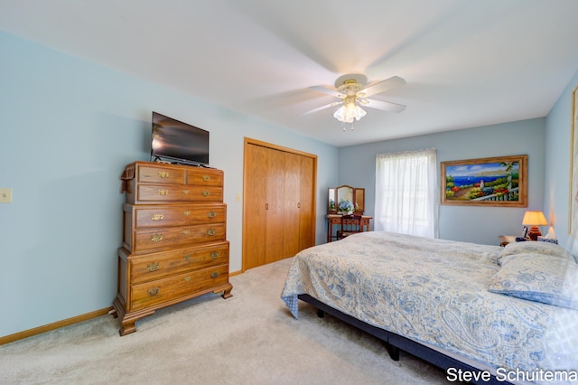 19151 Pine Grove Ct, Spring Lake, MI 49456 - carpeted bedroom featuring a closet, baseboards, and a ceiling fan