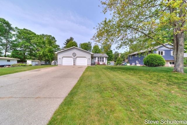 19151 Pine Grove Ct, Spring Lake, MI 49456 - view of front of property with a garage, driveway, and a front lawn