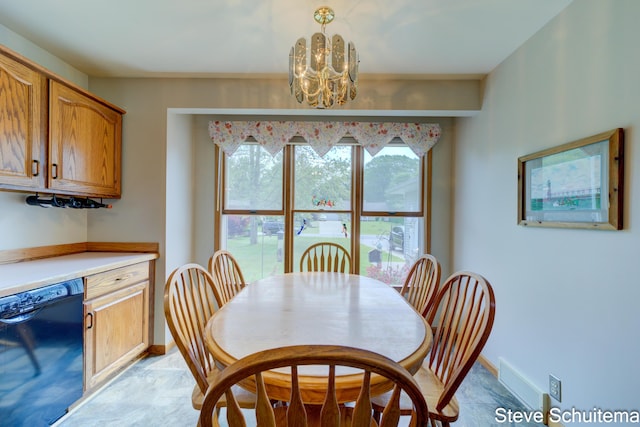 19151 Pine Grove Ct, Spring Lake, MI 49456 - dining area with a chandelier and baseboards