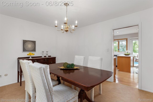 3379 Wormer Dr, Waterford, MI 48329 - dining room with light colored carpet, a chandelier, and baseboards