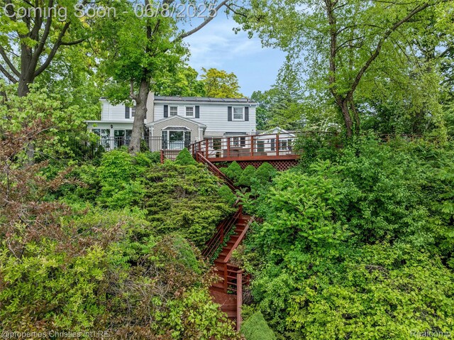 3379 Wormer Dr, Waterford, MI 48329 - rear view of property with stairs and a wooden deck