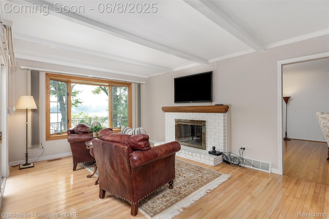 3379 Wormer Dr, Waterford, MI 48329 - living area featuring beam ceiling, light wood-type flooring, a fireplace, ornamental molding, and baseboards