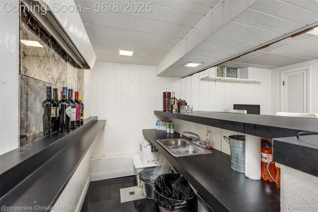 3379 Wormer Dr, Waterford, MI 48329 - kitchen with a sink, wood finished floors, and baseboards