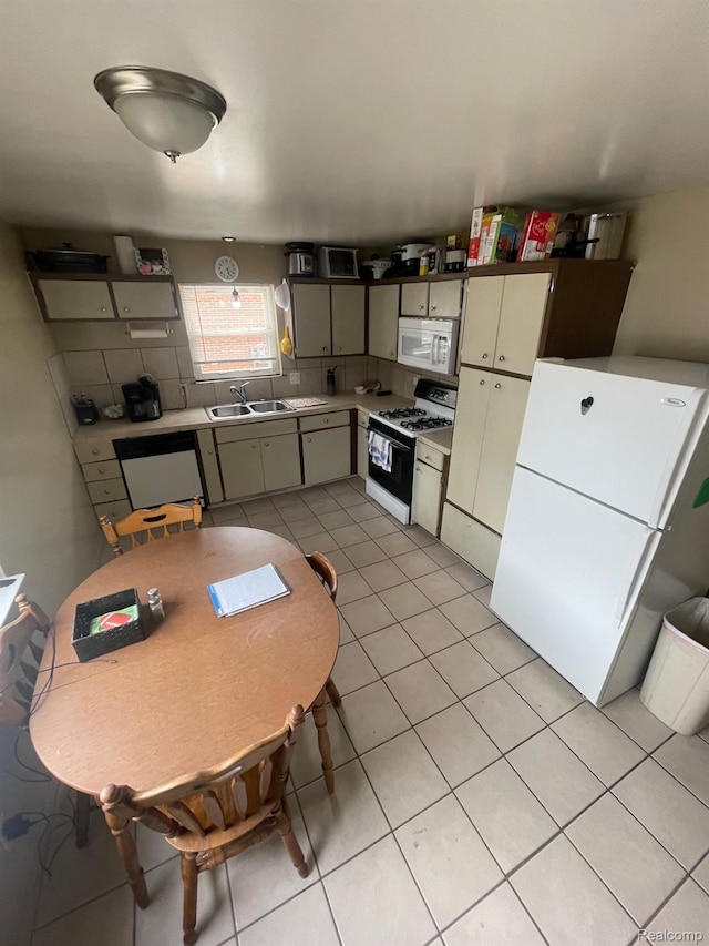 8415 Cappy Ln, Swartz Creek, MI 48473 - kitchen featuring white appliances, light tile patterned floors, and light countertops