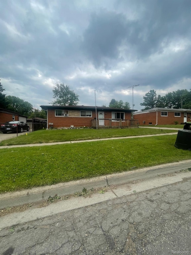 8415 Cappy Ln, Swartz Creek, MI 48473 - ranch-style home featuring brick siding and a front lawn