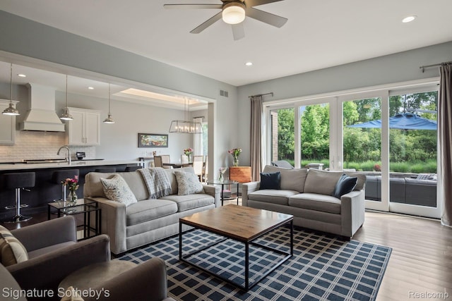 1641 Traceky, Rochester Hills, MI 48306 - living room featuring ceiling fan, wood finished floors, recessed lighting, and a chandelier