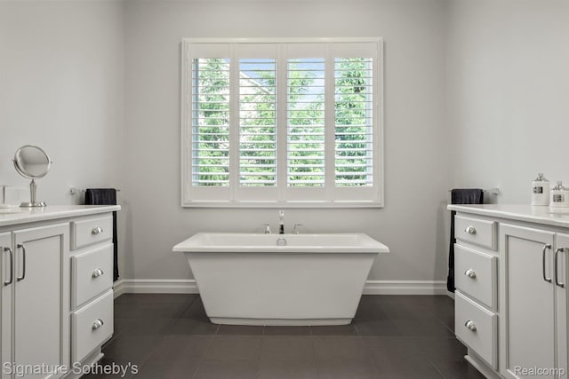 1641 Traceky, Rochester Hills, MI 48306 - bathroom featuring vanity, healthy amount of natural light, and a soaking tub
