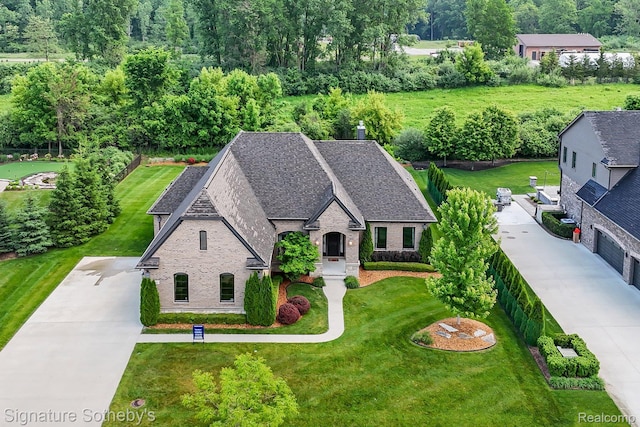 1641 Traceky, Rochester Hills, MI 48306 - view of front of house featuring stone siding, concrete driveway, a front lawn, and brick siding