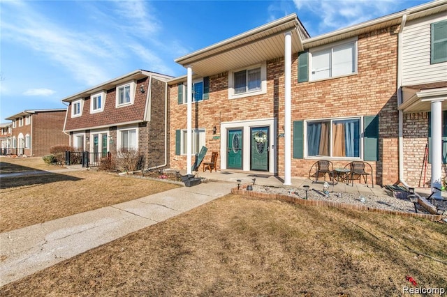 38132 Jamestown Dr, Sterling Heights, MI 48312 - view of front of house with brick siding and a front lawn
