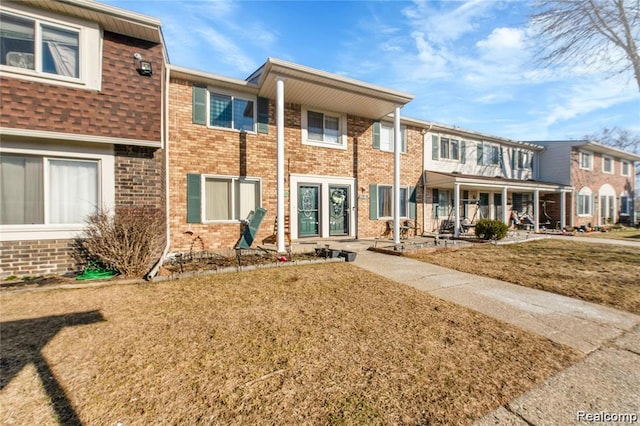 38132 Jamestown Dr, Sterling Heights, MI 48312 - view of front facade featuring brick siding and covered porch