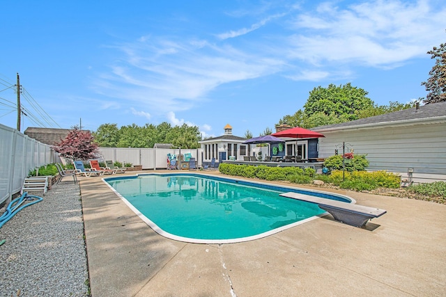 3210 Niles Buchanan Rd, Buchanan, MI 49107 - view of pool featuring a patio, a fenced backyard, and a diving board