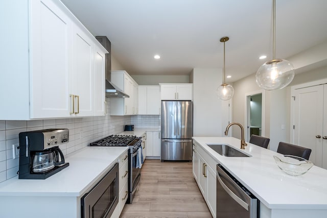 917 Harbor Dr E, Saint Joseph, MI 49085 - kitchen featuring appliances with stainless steel finishes, a sink, an island with sink, recessed lighting, and white cabinetry
