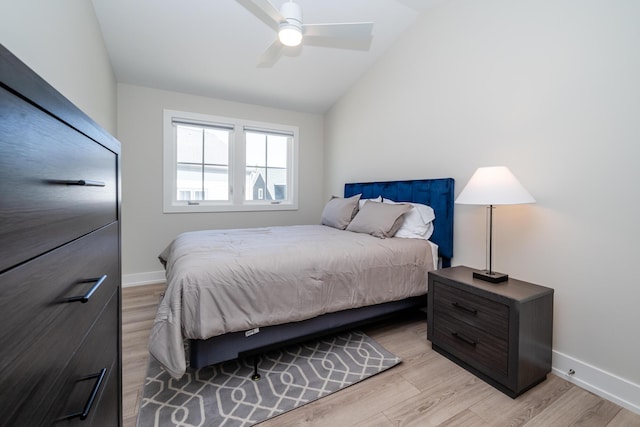 917 Harbor Dr E, Saint Joseph, MI 49085 - bedroom featuring light wood-type flooring, vaulted ceiling, baseboards, and ceiling fan