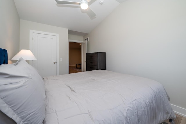 917 Harbor Dr E, Saint Joseph, MI 49085 - bedroom with wood finished floors, lofted ceiling, baseboards, and a ceiling fan