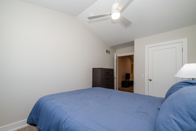 917 Harbor Dr E, Saint Joseph, MI 49085 - bedroom with vaulted ceiling, wood finished floors, baseboards, and ceiling fan