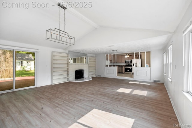 23808 Beierman Ave, Warren, MI 48091 - unfurnished living room featuring beamed ceiling, a fireplace, high vaulted ceiling, and wood finished floors