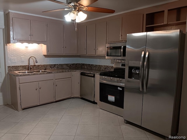 23808 Beierman Ave, Warren, MI 48091 - kitchen featuring appliances with stainless steel finishes, a sink, a ceiling fan, decorative backsplash, and light tile patterned flooring