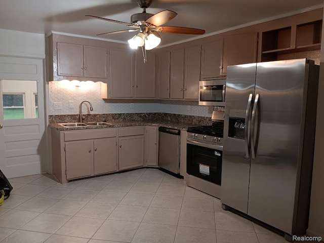 23808 Beierman Ave, Warren, MI 48091 - kitchen with appliances with stainless steel finishes, a sink, a ceiling fan, decorative backsplash, and light tile patterned flooring