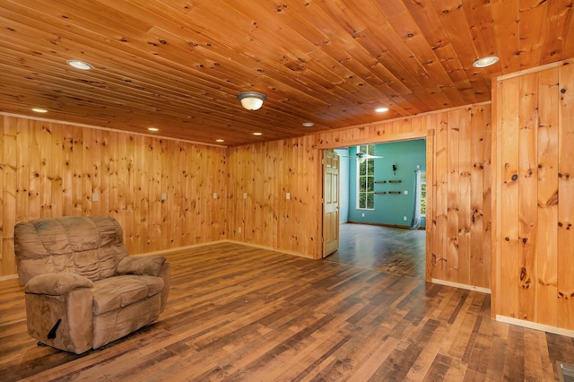 6997 W Woodlea Rd, Oscoda, MI 48750 - unfurnished room featuring wood finished floors, recessed lighting, wood walls, wood ceiling, and baseboards
