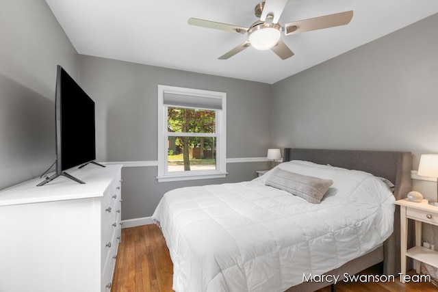 815 Reynard St SE, Grand Rapids, MI 49507 - bedroom with wood finished floors, baseboards, and a ceiling fan