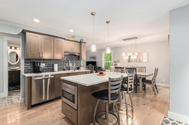 1518 White Pine Ct, Twin Lake, MI 49457 - kitchen featuring appliances with stainless steel finishes, baseboards, light wood-style floors, and recessed lighting