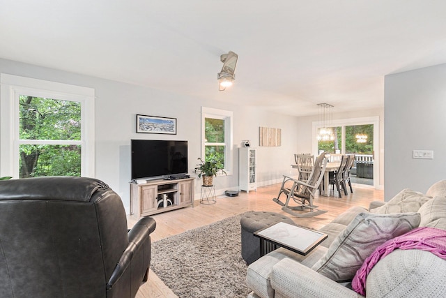 1518 White Pine Ct, Twin Lake, MI 49457 - living area featuring light wood-style flooring and baseboards