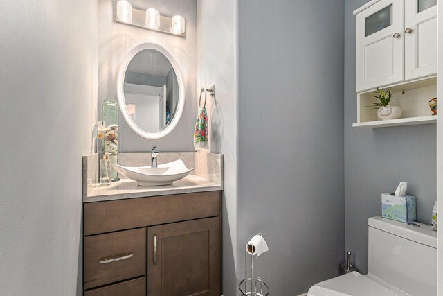 1518 White Pine Ct, Twin Lake, MI 49457 - bathroom featuring vanity and toilet
