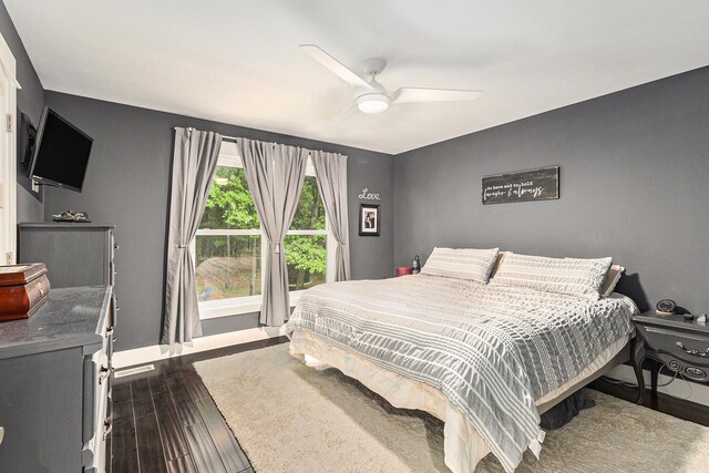 1518 White Pine Ct, Twin Lake, MI 49457 - bedroom featuring dark wood-style flooring, baseboards, and a ceiling fan