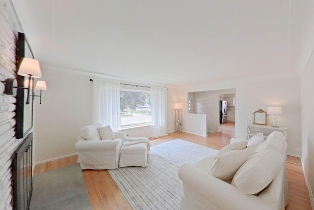 2113 12th St, Wyandotte, MI 48192 - living area with light wood-type flooring and baseboards