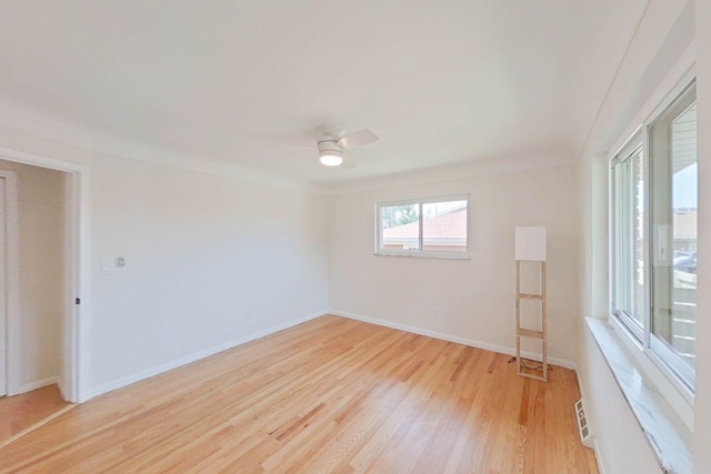 2113 12th St, Wyandotte, MI 48192 - unfurnished room with light wood-type flooring, ceiling fan, and baseboards