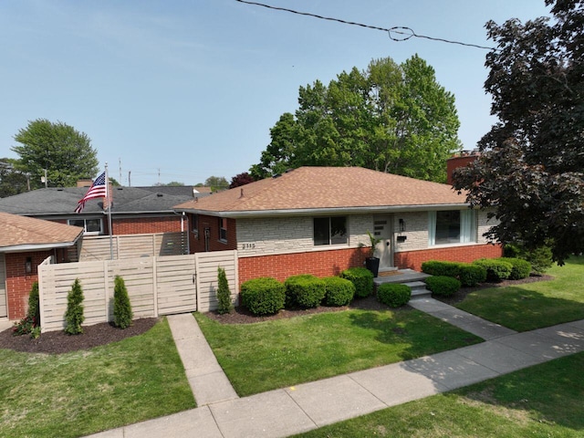 2113 12th St, Wyandotte, MI 48192 - view of front of property featuring a gate, brick siding, and a chimney