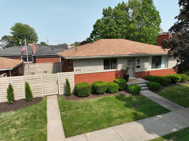 2113 12th St, Wyandotte, MI 48192 - ranch-style house featuring brick siding, a chimney, a gate, and a shingled roof