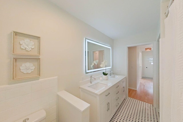 2113 12th St, Wyandotte, MI 48192 - bathroom featuring double vanity and toilet