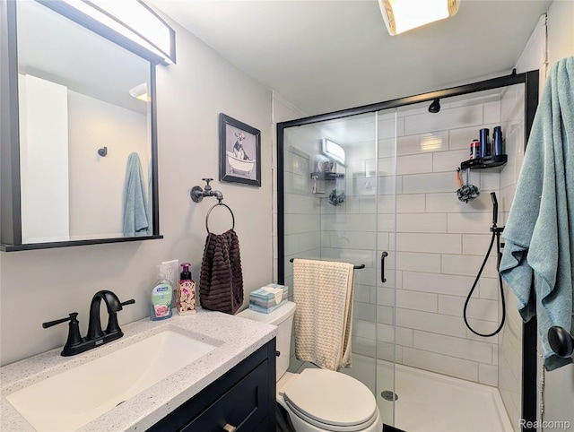 3730 Pinelands Rd, Gladwin, MI 48624 - full bathroom featuring vanity, a shower stall, and toilet